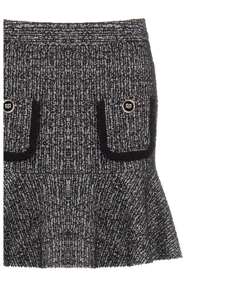 Mini-jupe en tweed avec bas volanté et petites poches effilochées Rinascimento